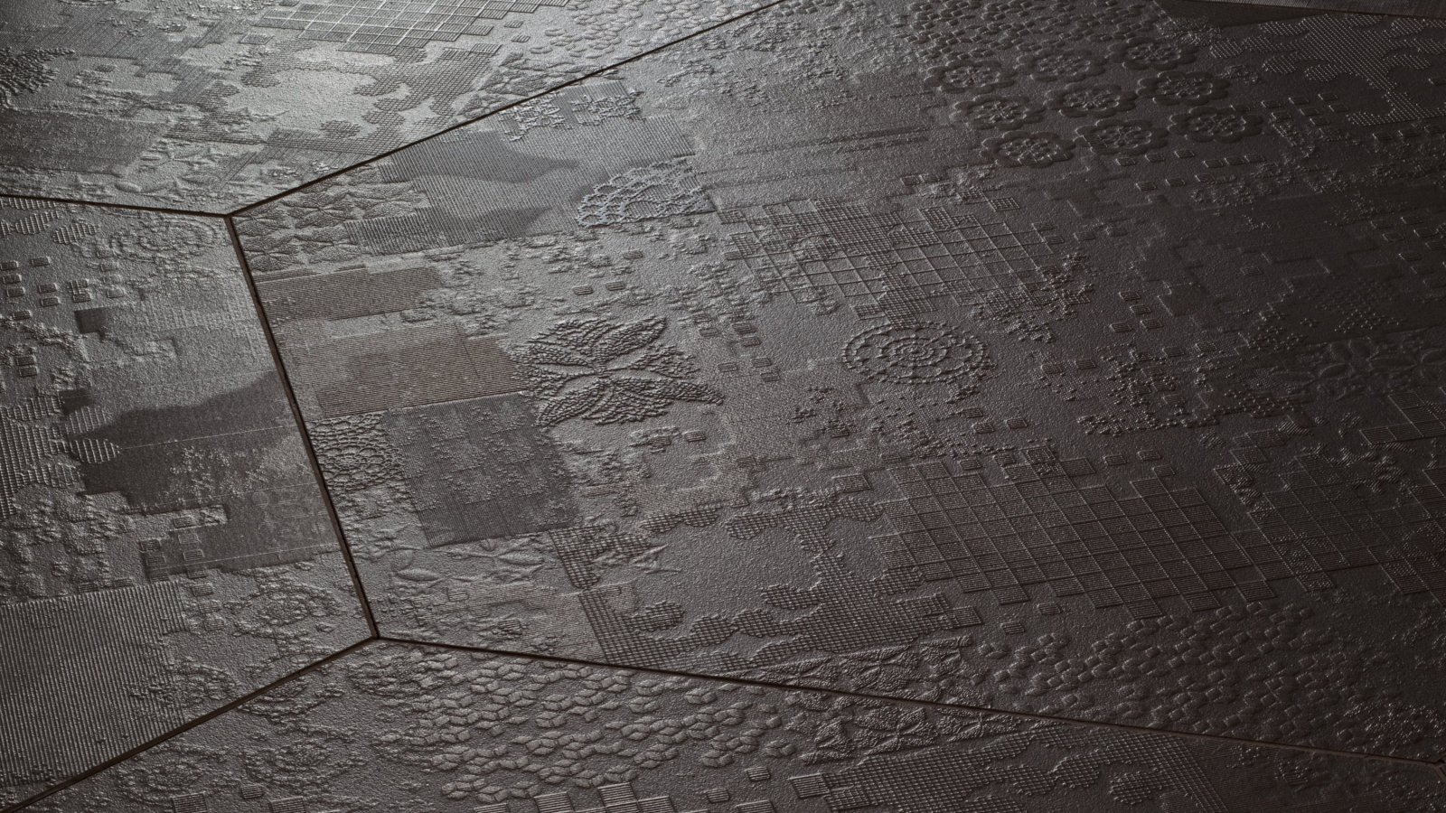 Pavimento in gres Déchirer di Mutina con bassorilievo effetto cemento