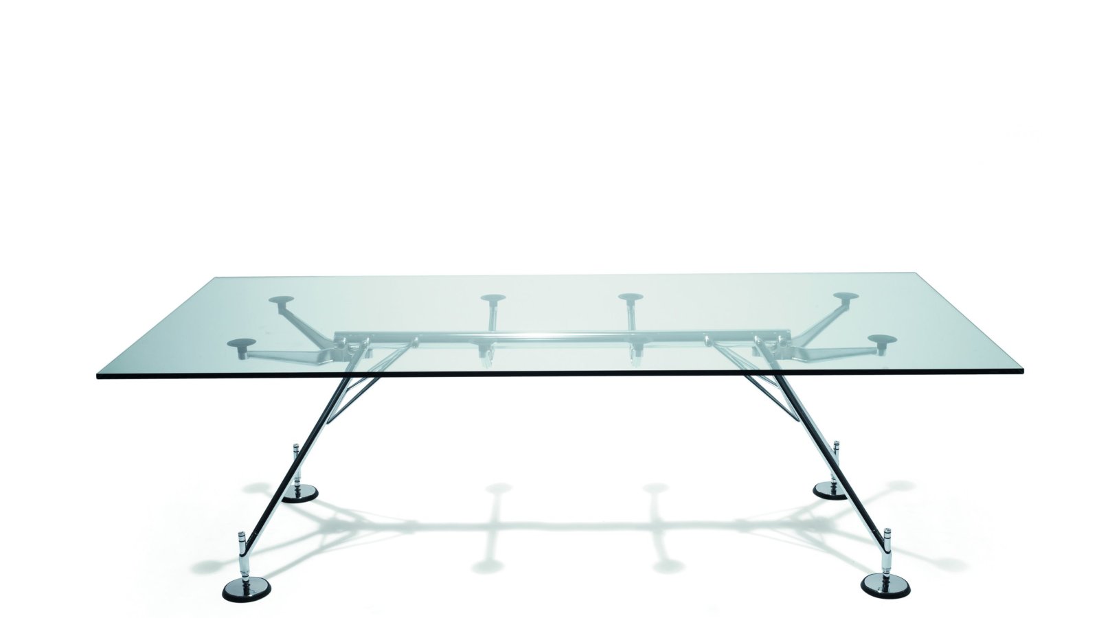 Sistema Nomos di Tecno con dorsale tubolare metallica e piano in vetro temperato