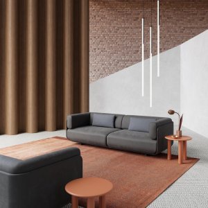 Pouf e dormeuse Shaal accostati in una lounge residenziale
