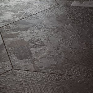 Pavimento in gres Déchirer di Mutina con bassorilievo effetto cemento