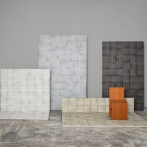 Parete area break con gres Aurore Light Green Grid L e tinta unita